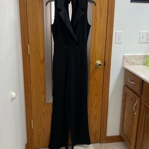Sleek Black Pantsuit with Plunging Neckline and Wide-Leg Design